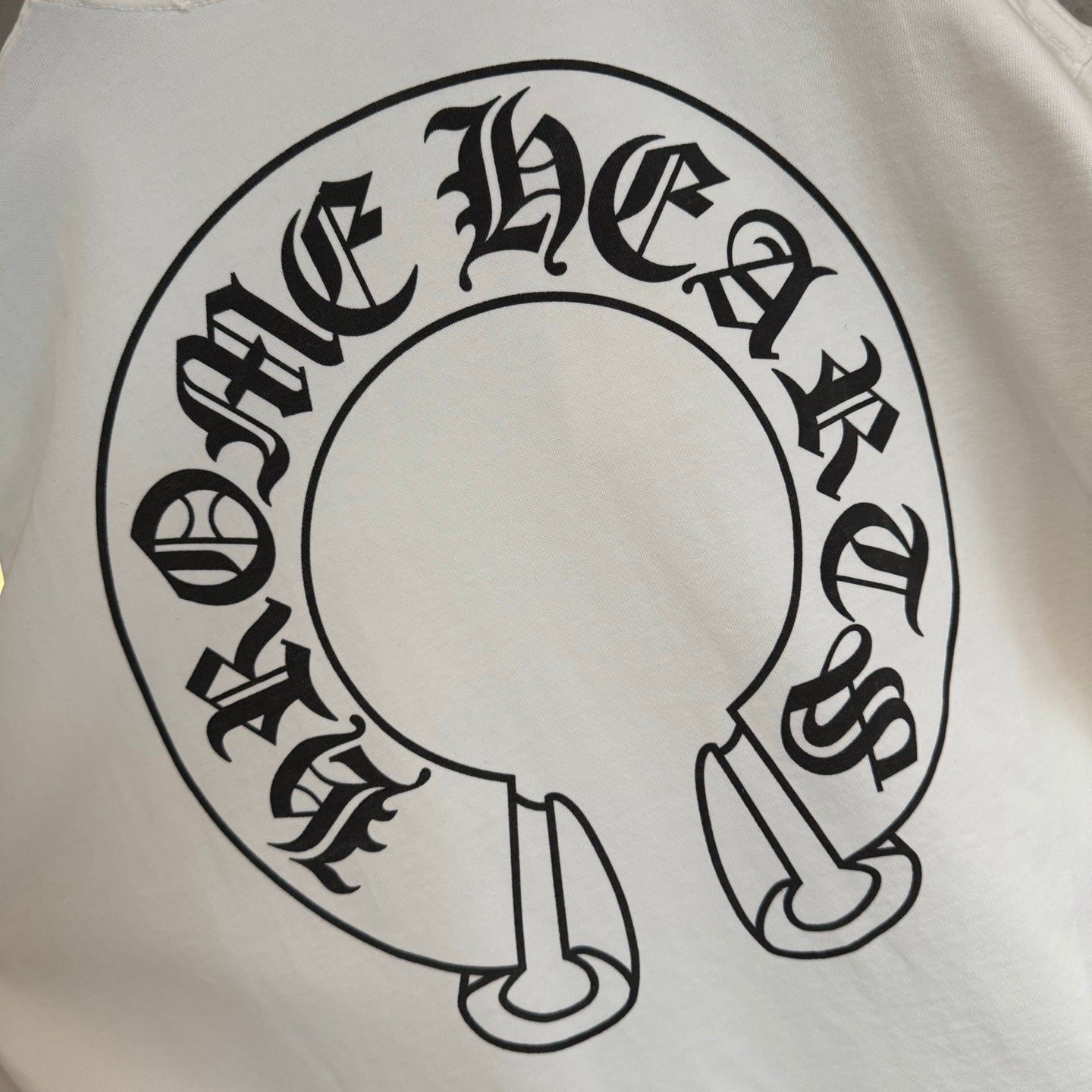 White long-sleeve T-shirt close-up of large back circular headphones graphic