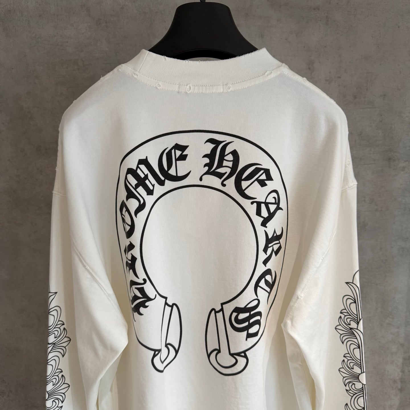 White long-sleeve T-shirt with large back circular headphones graphic, crew neckline
