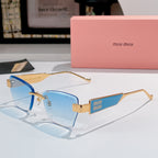 Glasses with gold-tone frames and light blue tinted lenses, with miu miu logo temple