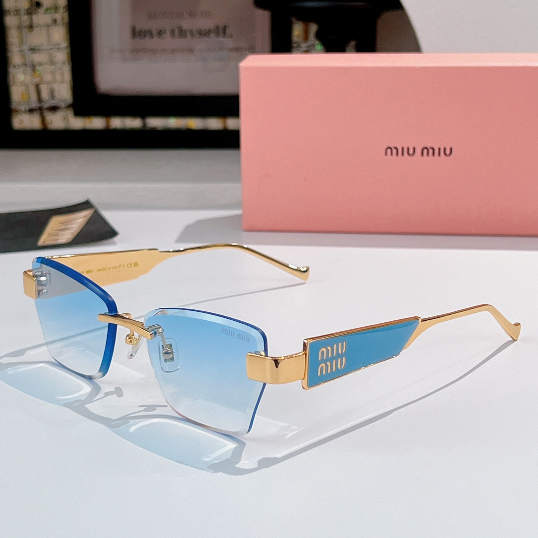 Glasses with gold-tone frames and light blue tinted lenses, with miu miu logo temple