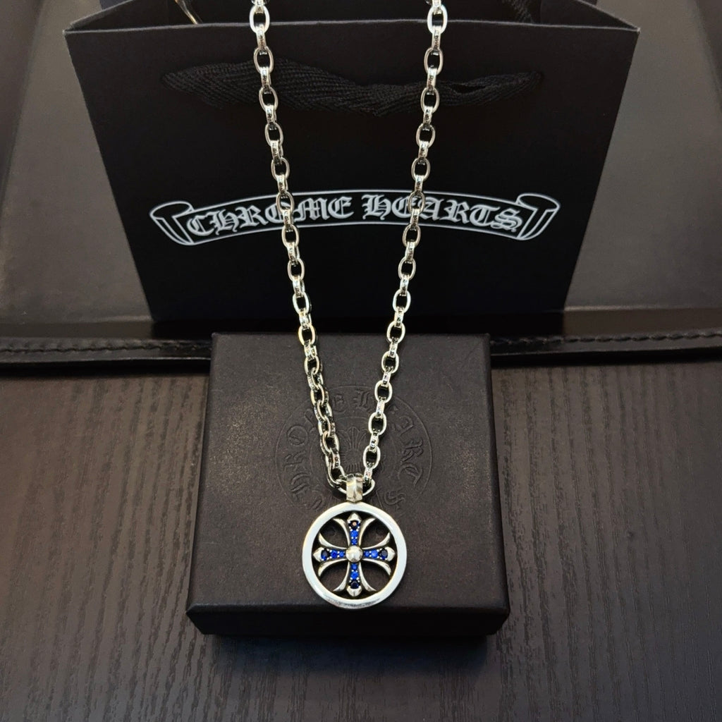 Round pendant necklace with blue center star on silver-tone chain