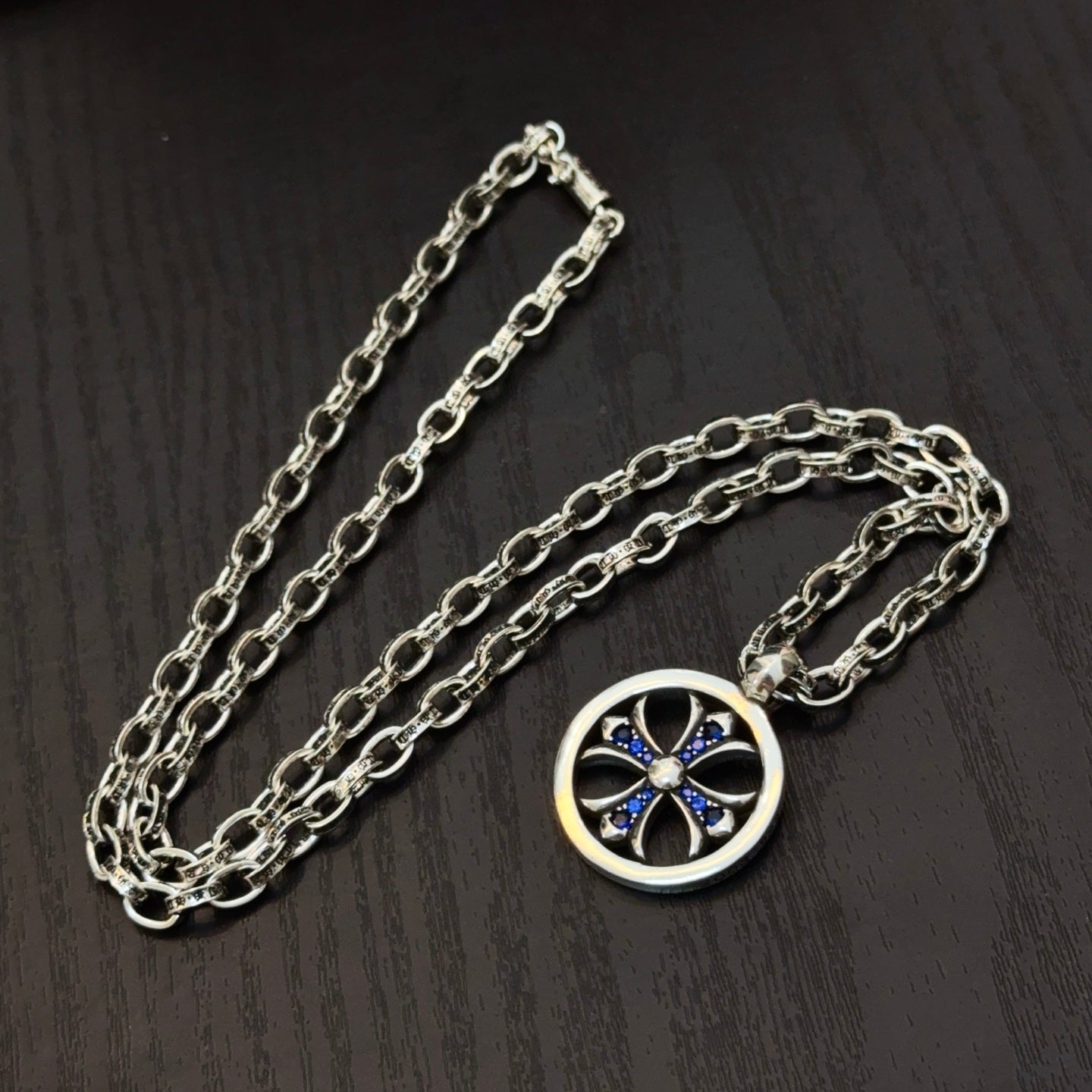 Silver-tone chain necklace with round blue star pendant