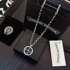 Round blue star pendant on layered silver-tone chain with jewelry tag