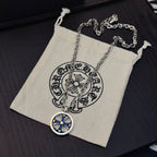Round blue star pendant necklace with silver-tone chain in small pouch