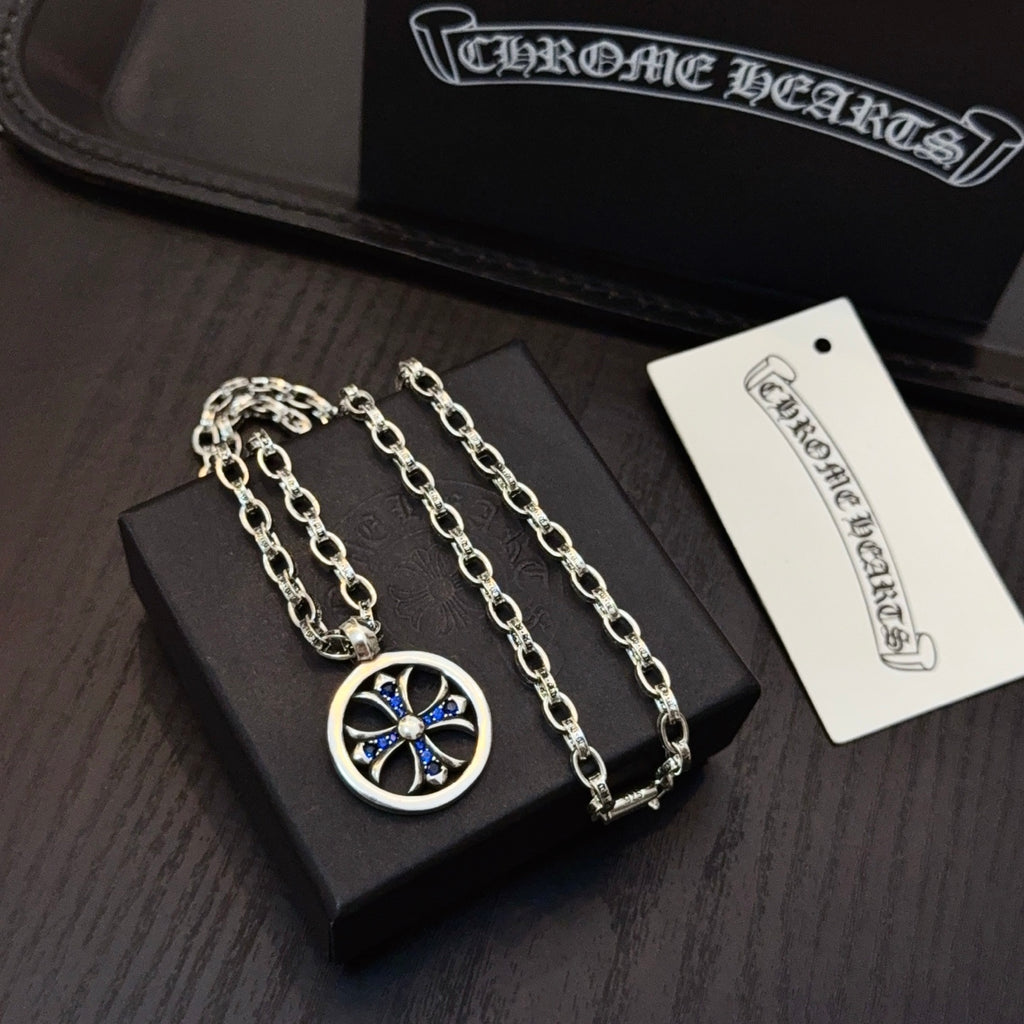 Silver-tone necklace with round blue star pendant and two chain links