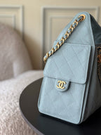 Chanel quilted flap bag, light blue with chain strap and front CC logo