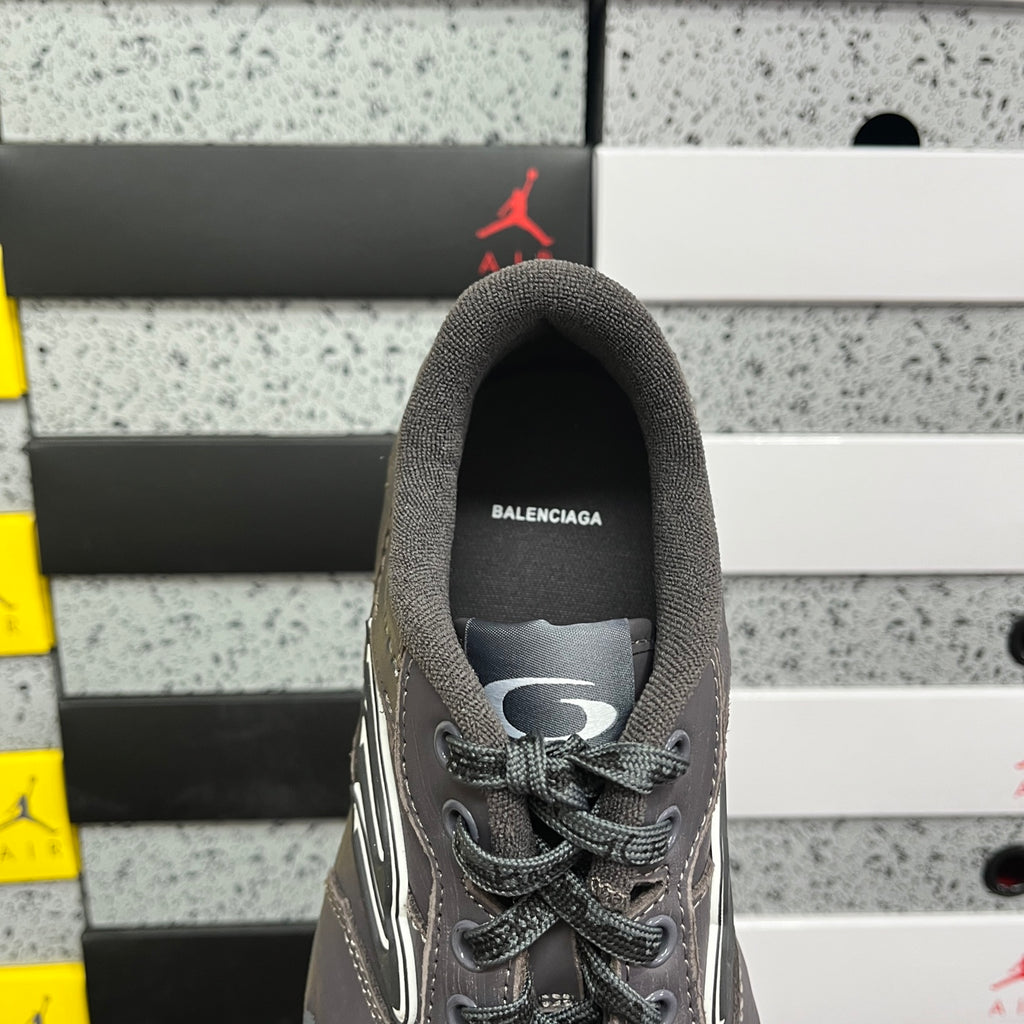 Grey Balenciaga lace-up sneaker with rear collar and top eyelet view