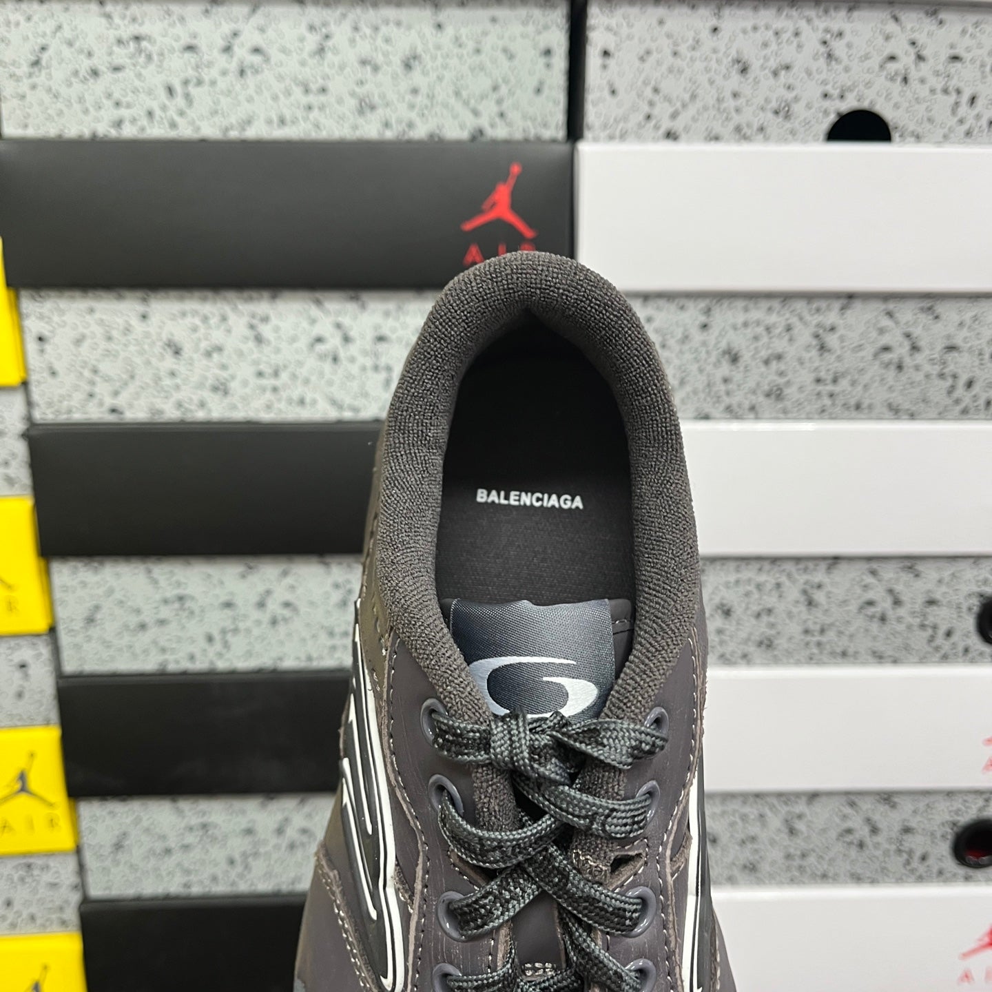 Grey Balenciaga lace-up sneaker with rear collar and top eyelet view