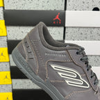 Grey Balenciaga lace-up sneaker with side logo patch and perforated trim