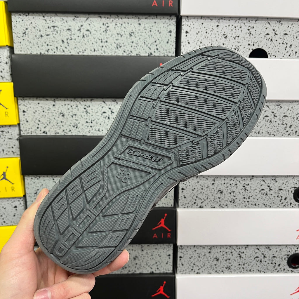 Grey Balenciaga sneaker outsole with tread pattern and embossed brand mark