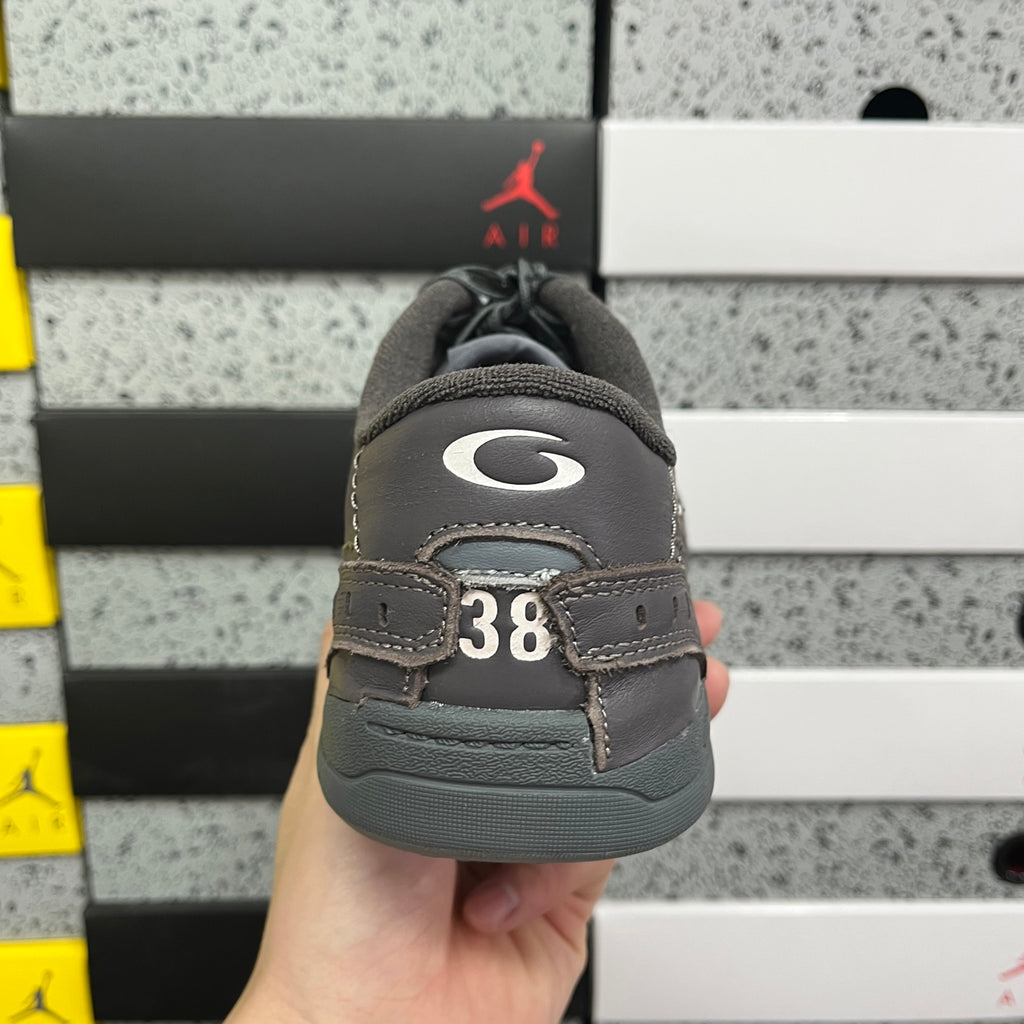 Grey Balenciaga sneaker heel with number 38 patch and padded back