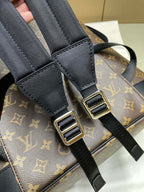 Adjustable black shoulder straps with metal buckles on Louis Vuitton monogram bag