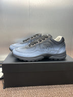 Unisex sneakers profile view, light blue leather with Chanel CC emblem
