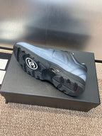 Unisex sneakers outsole view, light blue uppers with dark tread and Chanel CC detail