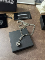 Chrome Hearts pendant necklace with flower medallion and cross charm