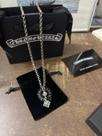 Chrome Hearts pendant necklace set with two silver-tone chains and charms
