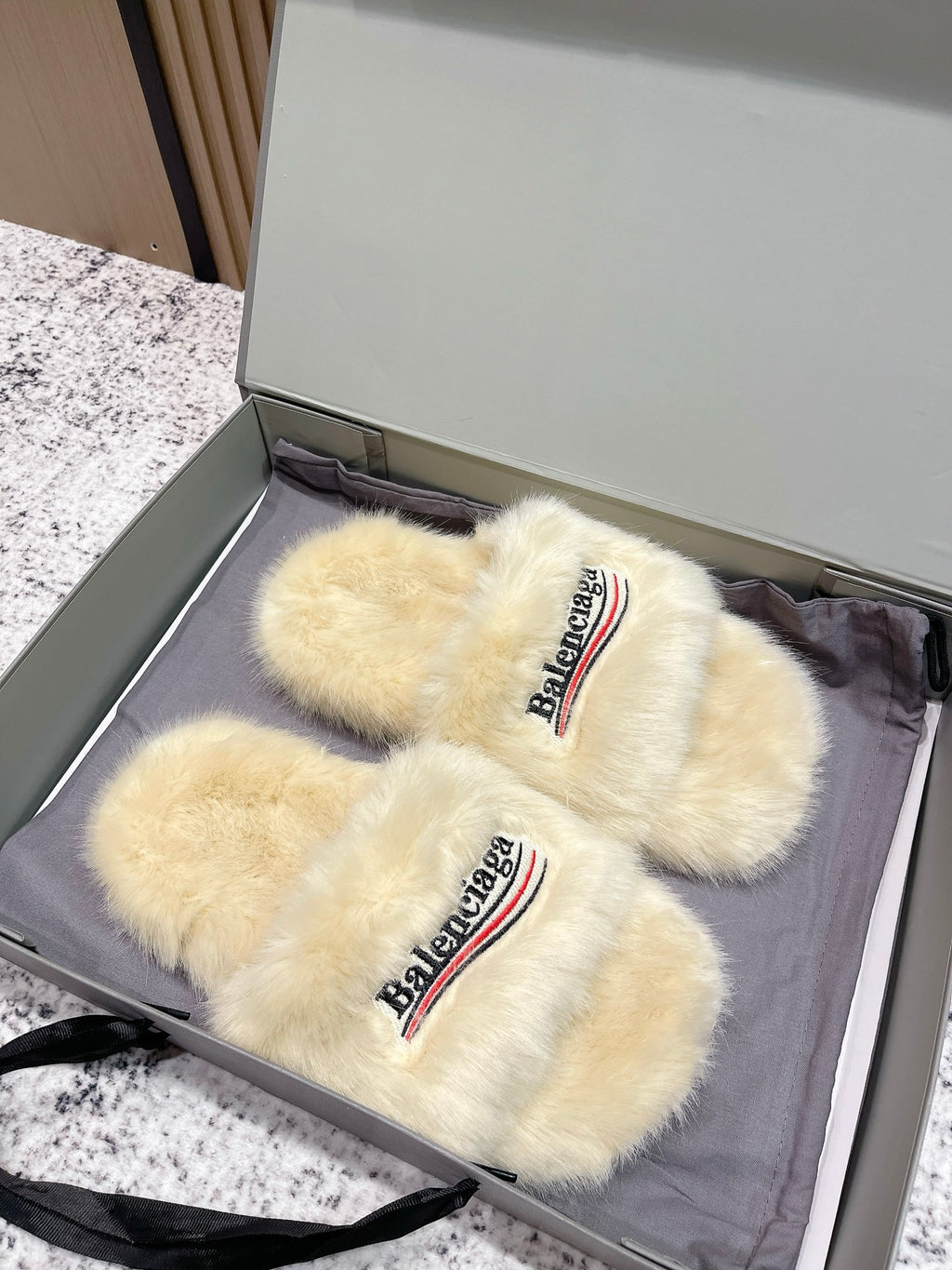 Faux fur slide sandals set in box, cream straps with Balenciaga logo
