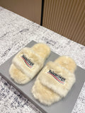 Faux fur slide sandals with Balenciaga logo on cream straps