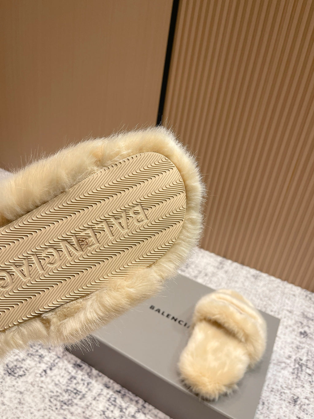 Faux fur slide sandal outsole with textured tread