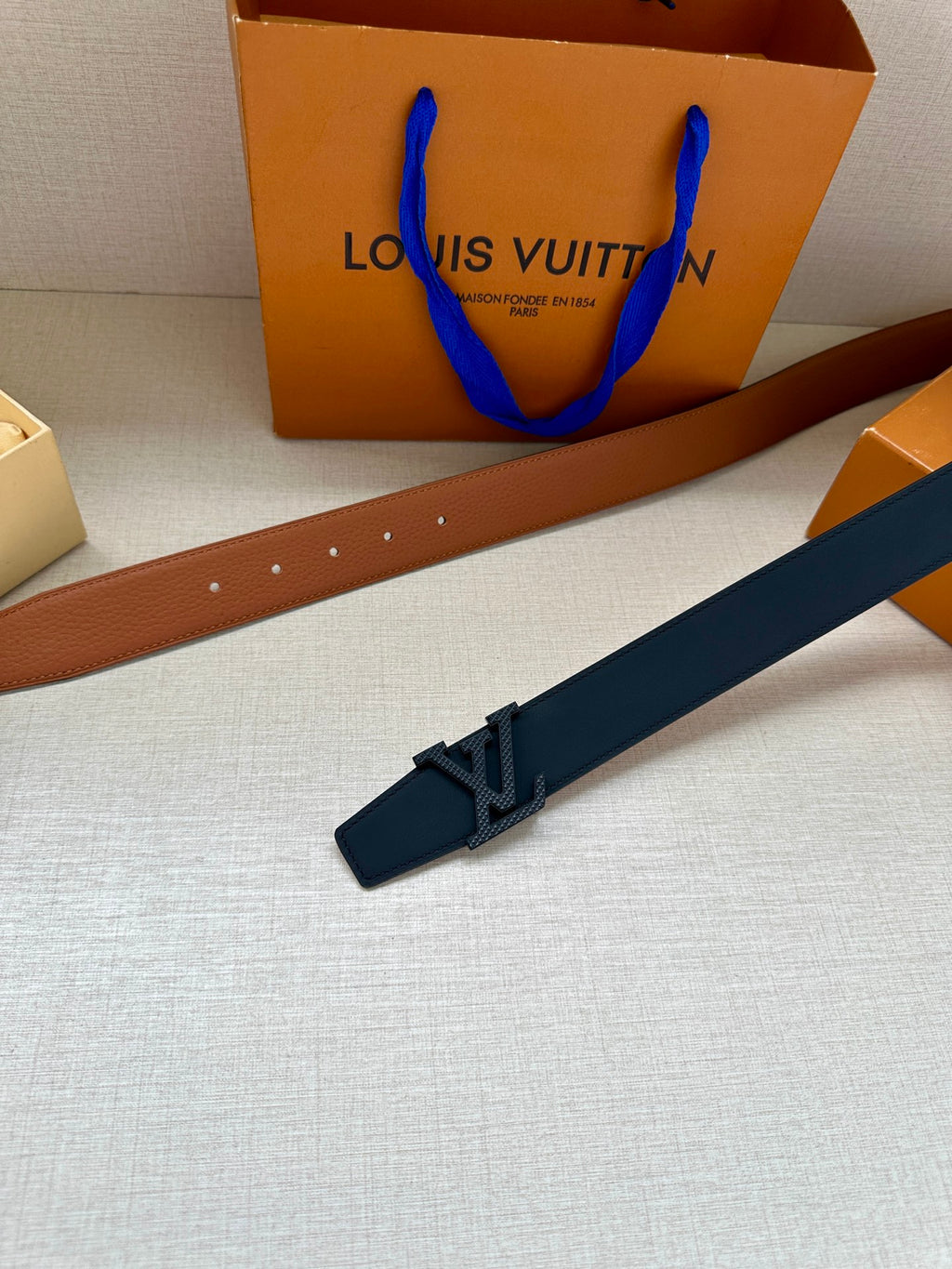 Louis Vuitton dark navy leather belt with rectangular buckle keeper