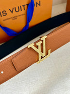 Louis Vuitton tan leather belt with textured keeper and gold-tone LV buckle