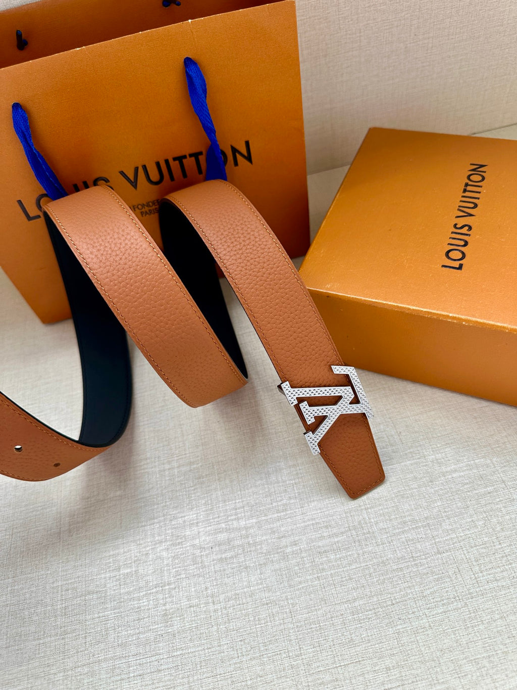 Louis Vuitton tan leather belt with gold-tone LV buckle and long strap ends