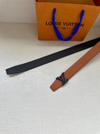 Louis Vuitton belt laid flat, tan strap with LV buckle and dark backing