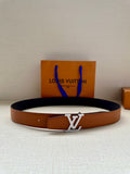 Louis Vuitton leather belt with LV silver buckle, tan strap and dark inner lining