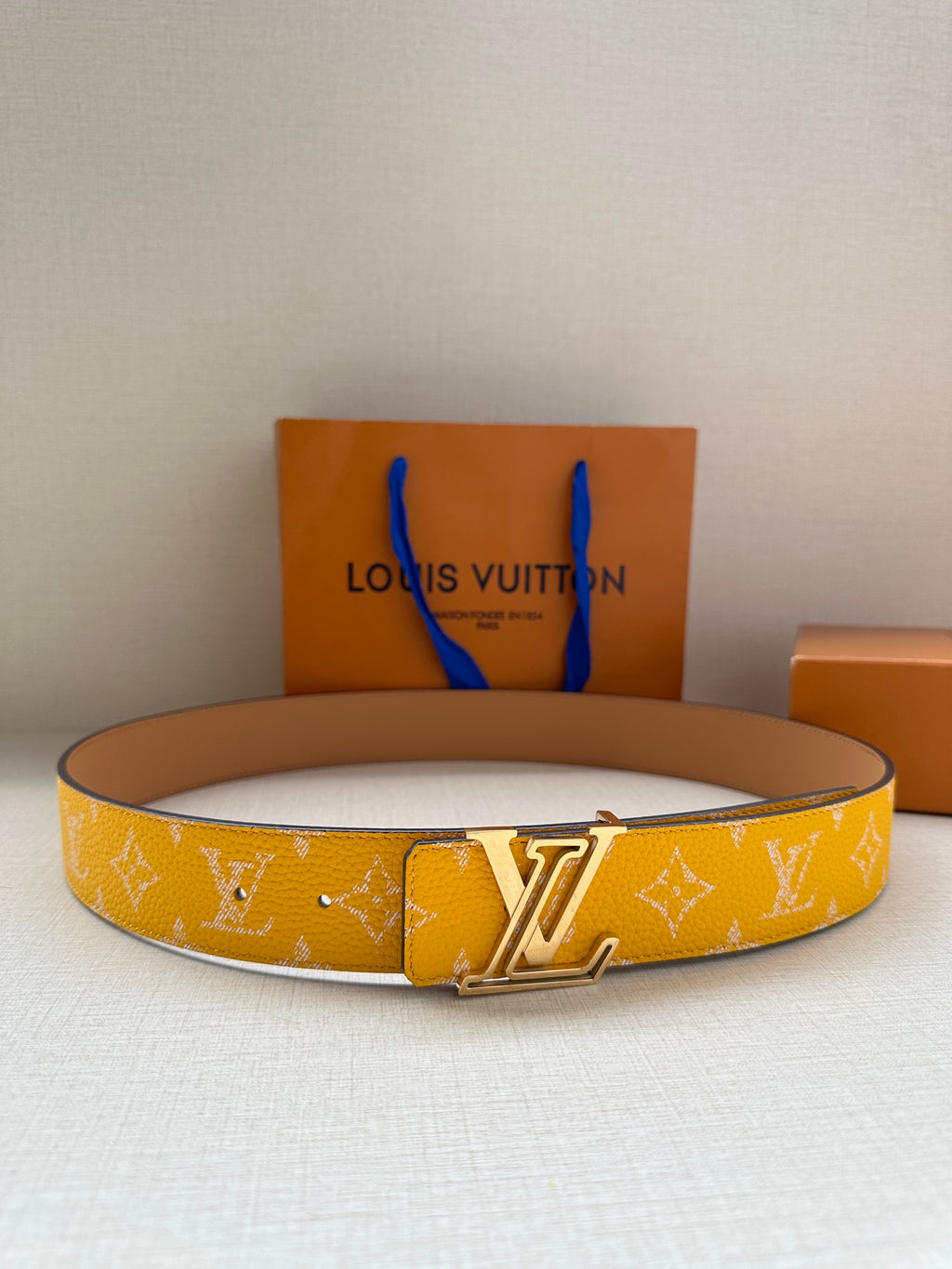 Yellow monogram belt with gold-tone LV buckle