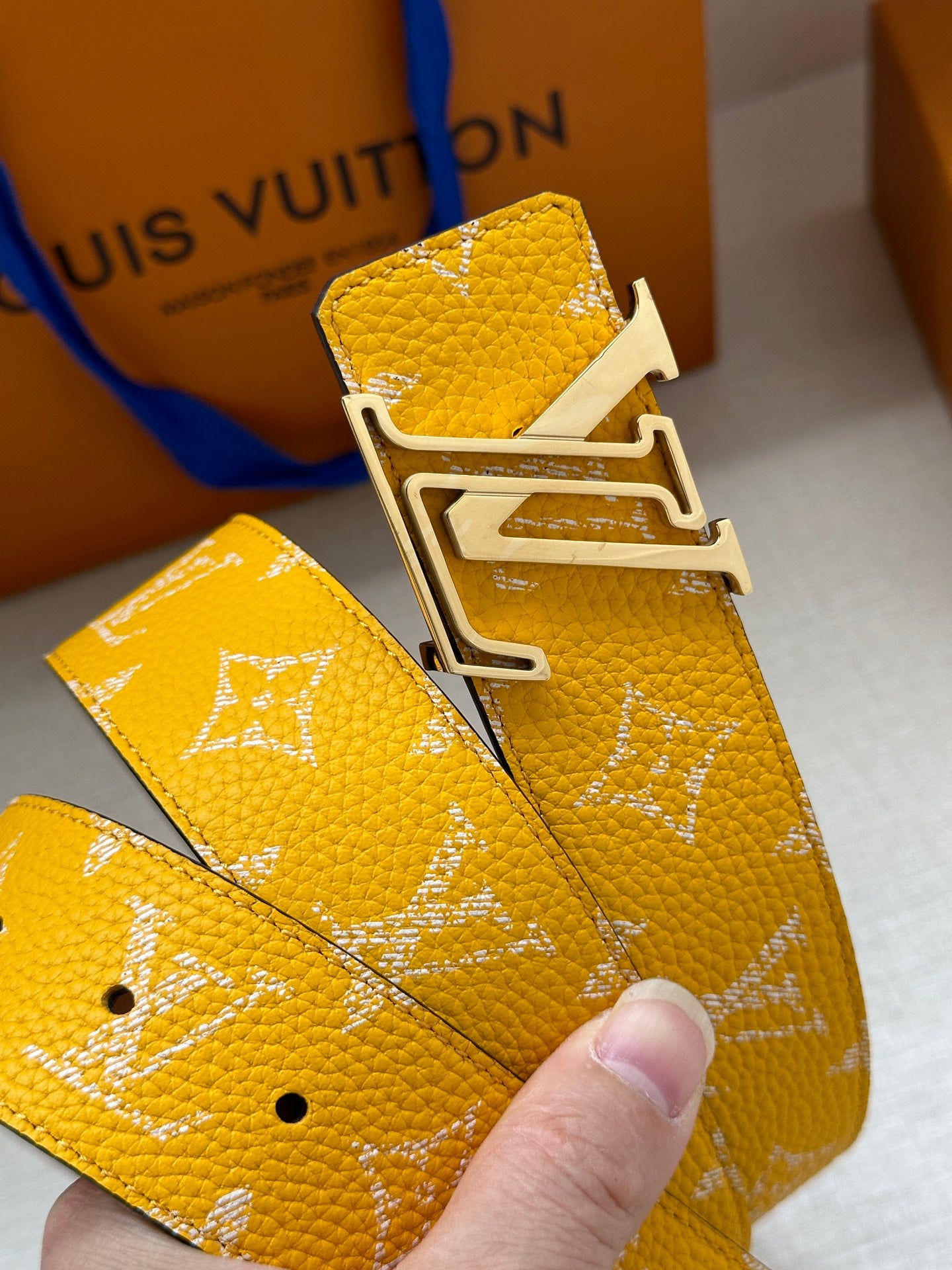 Yellow monogram belt strap with gold-tone adjustable buckle