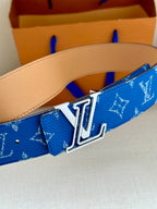 Blue monogram Louis Vuitton belt with silver LV buckle and tan leather backing