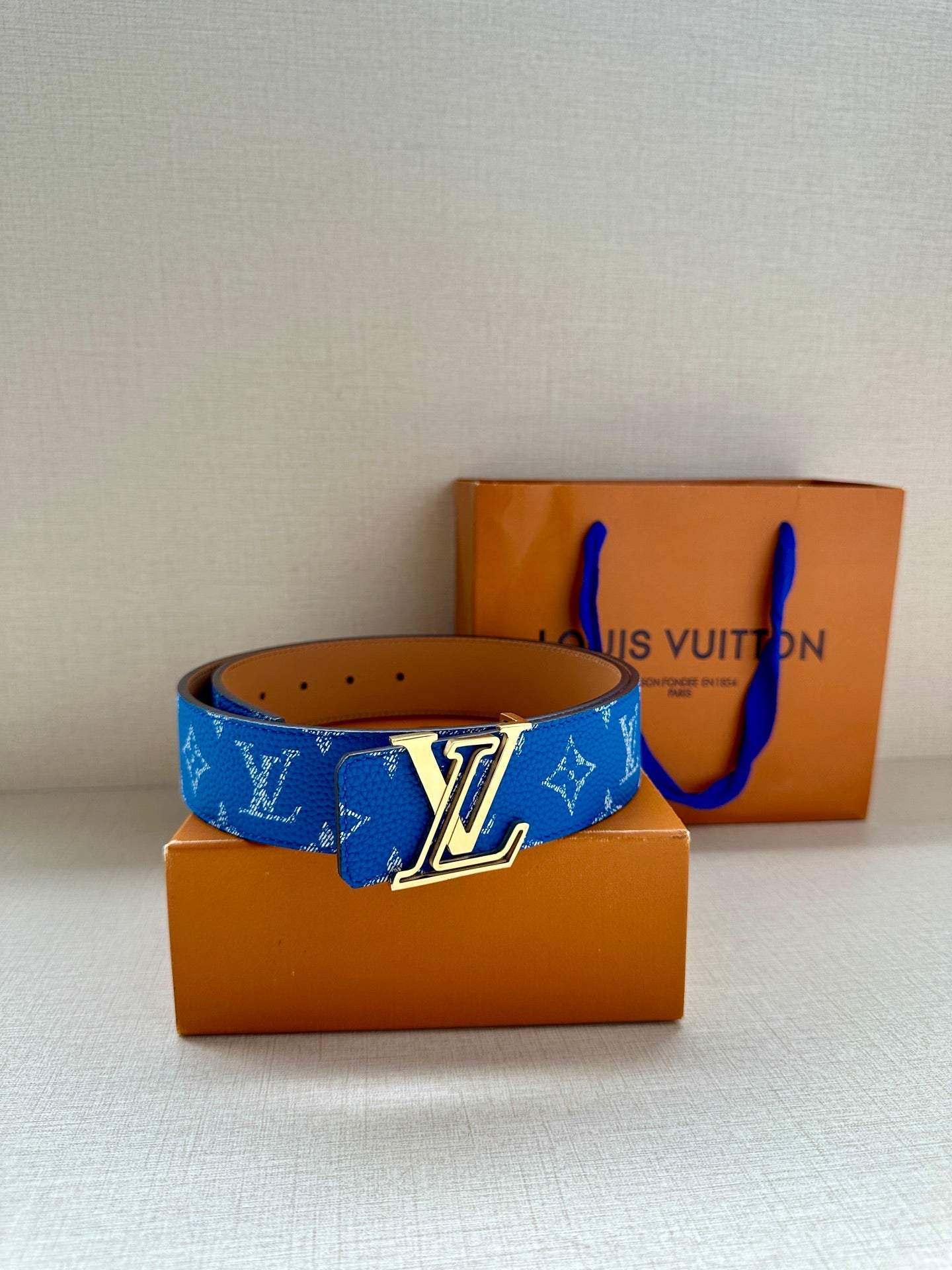 Blue Louis Vuitton belt with monogram print and silver-tone LV buckle detail