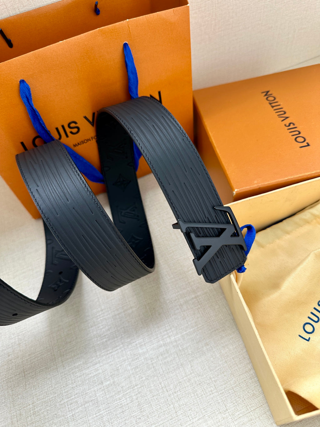 Louis Vuitton monogram belt strap with adjustable holes and LV buckle