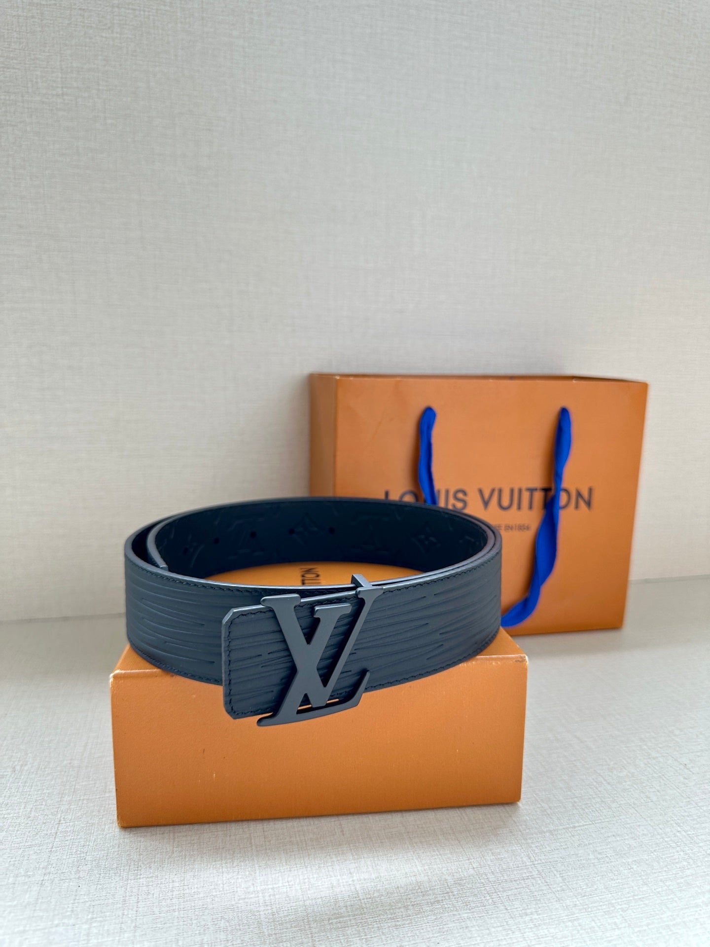 Louis Vuitton monogram belt with wide dark strap and LV buckle