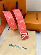Louis Vuitton belt folded display: red monogram canvas with gold-tone LV buckle