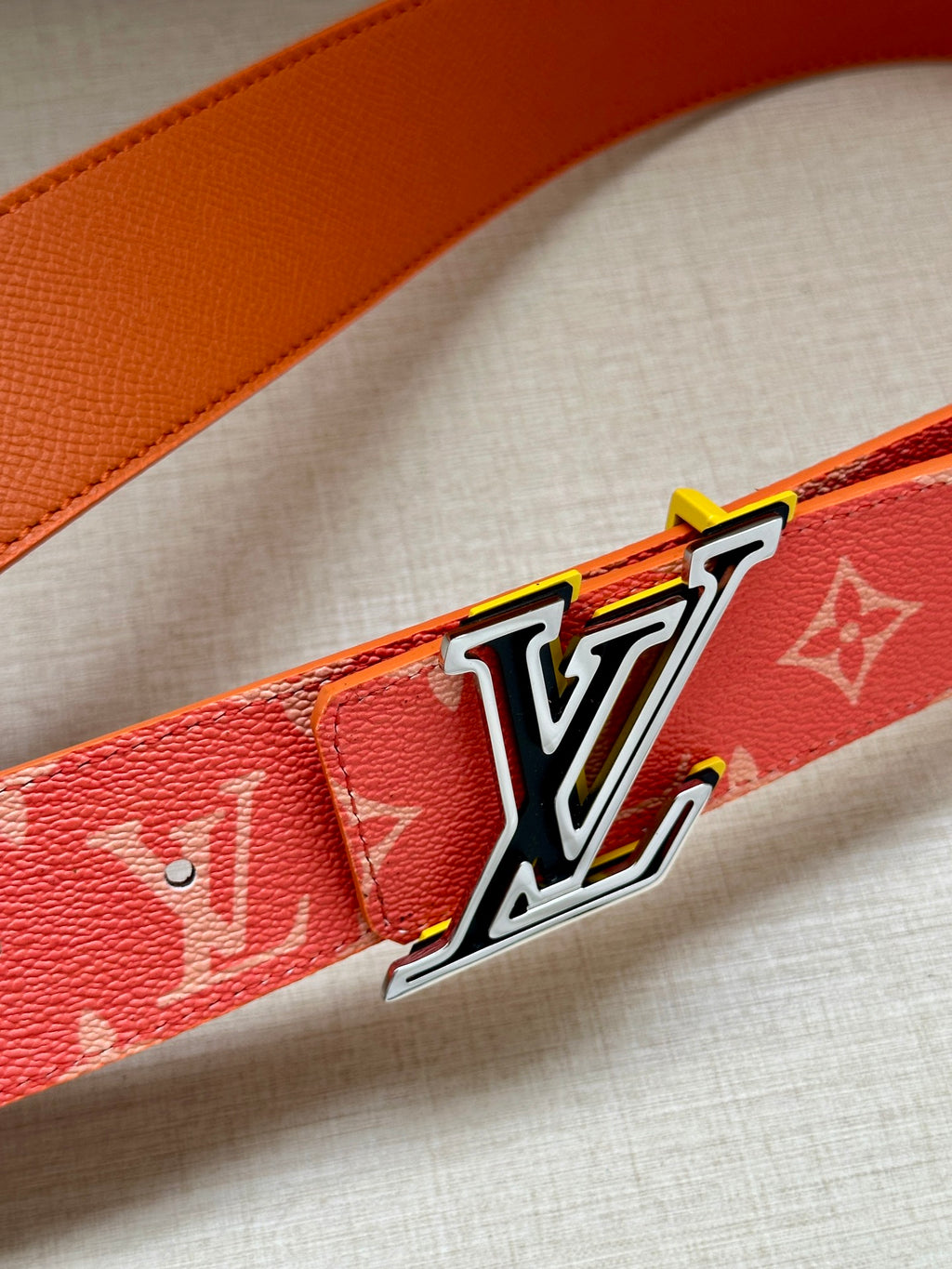 Louis Vuitton belt strap in orange leather with large silver-tone LV buckle