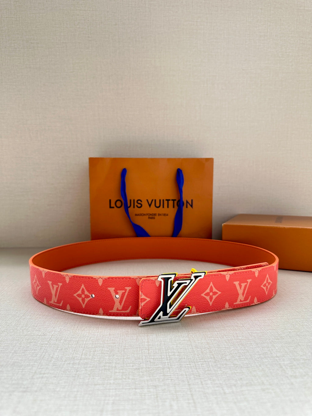 Louis Vuitton belt in red monogram canvas with silver-tone LV buckle