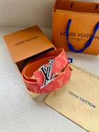 Louis Vuitton belt in red monogram canvas with LV buckle on open box