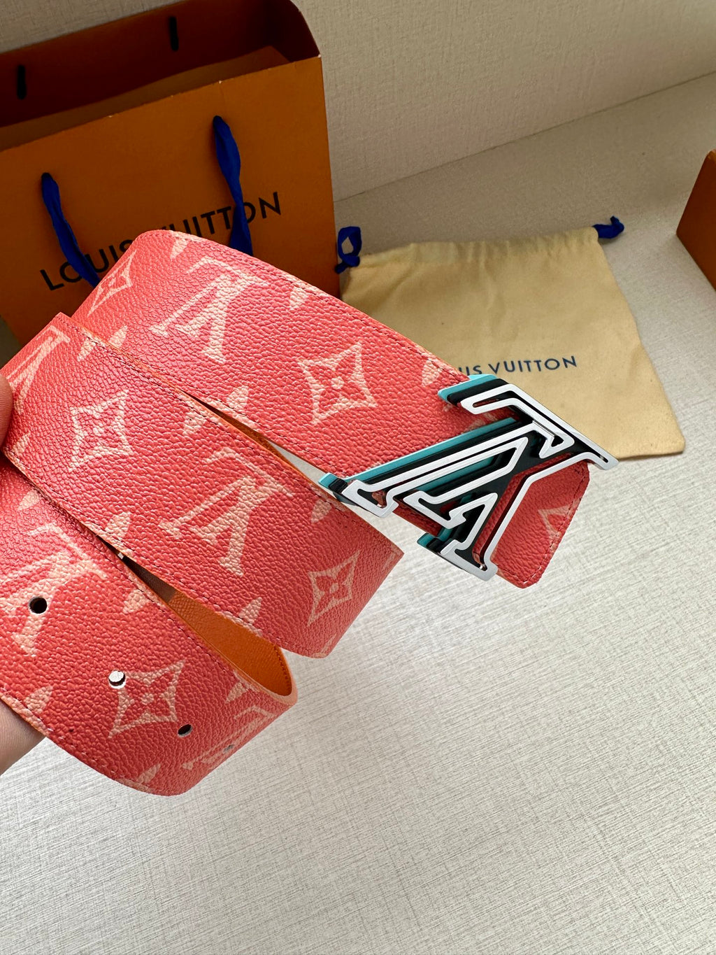 Louis Vuitton belt in red monogram canvas with silver-tone LV buckle detail