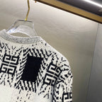 Givenchy knit sweater close-up, black-and-white geometric pattern panel