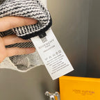Givenchy size and care label on black-and-white knit sweater
