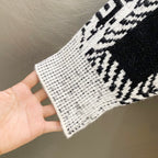 Givenchy knit sweater cuff and knit texture, black-and-white geometric pattern