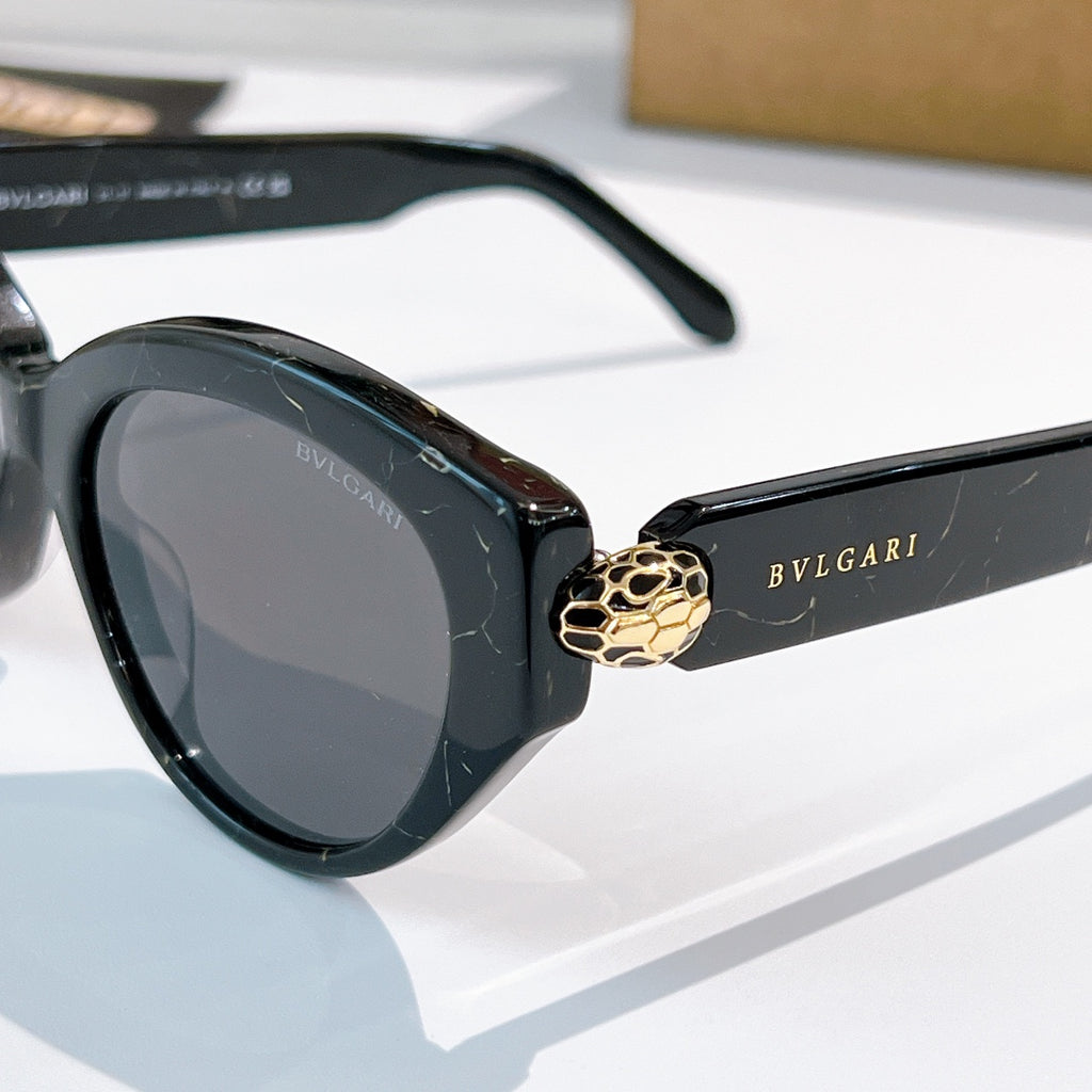 Bvlgari cat-eye sunglasses close-up, black frames, gray lenses, gold emblem