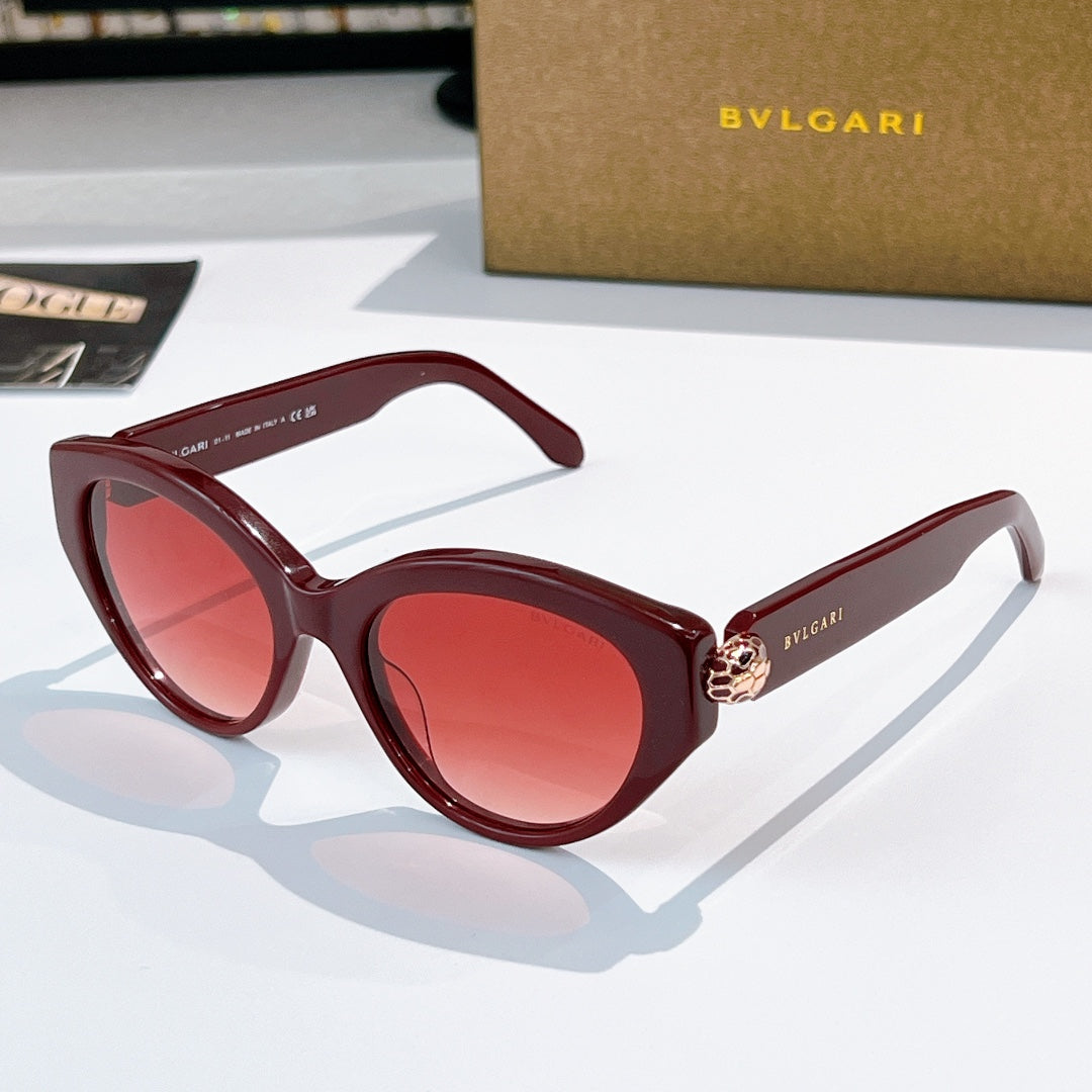Bvlgari cat-eye sunglasses, burgundy frames, red-tinted lenses, gold emblem bridge
