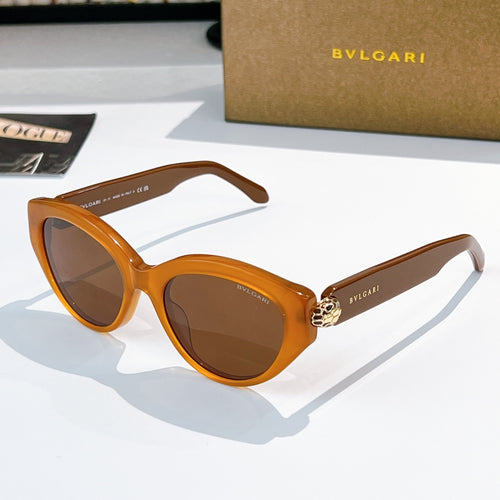 Bvlgari cat-eye sunglasses, amber frames, brown lenses, gold emblem bridge