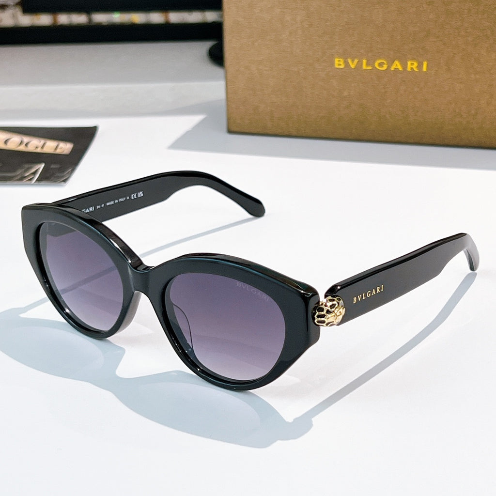 Bvlgari cat-eye sunglasses, black frames, purple-tinted lenses, gold emblem bridge
