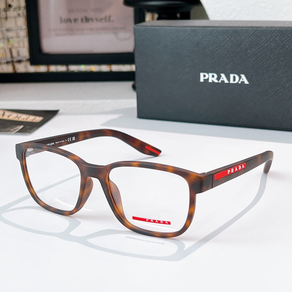 Prada glasses with tortoiseshell frames and clear lenses, red logo temple detail