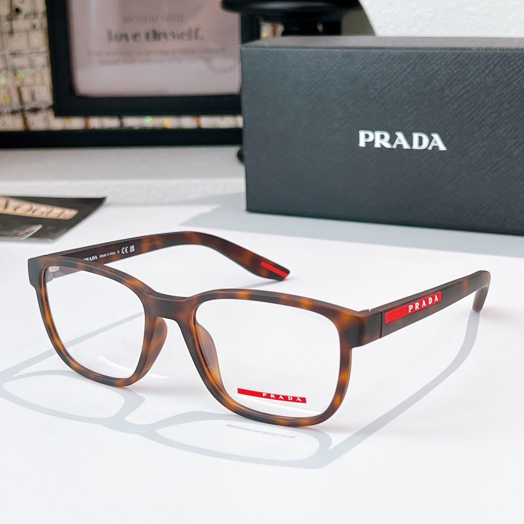 Prada glasses with tortoiseshell frames and clear lenses, red logo temple detail