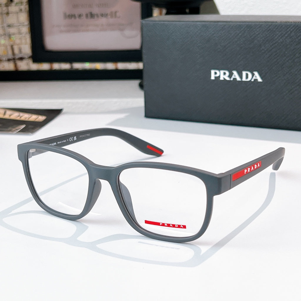 Prada glasses with light gray frames and clear lenses, red logo temple detail