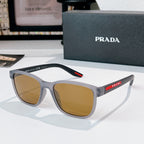 Prada glasses with light gray frames and brown tinted lenses, red logo temple detail